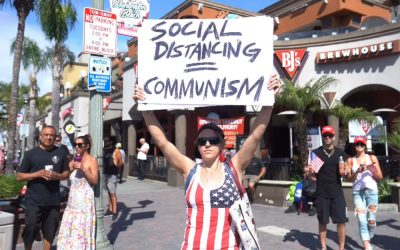 Demonstrators gather in Huntington Beach to protest California’s stay-at-home order